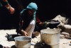 Afghanistan: Woman cooking - photo by Anne Dinnan