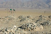 Afghanistan - Herat province - graveyard - cairns  with green flags - photo by E.Andersen