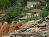Kamnik, Kolonj, Kor county, Albania: schist roof and haystacks - rural scene - photo by J.Kaman
