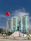 Durres / Drach, Albania: Albanian flag and apartment buildings - photo by J.Kaman