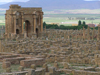 Algeria / Algerie - Timgad: Arch of Trajan among the ruins - grid plan - Roman city planning - photo by J.Kaman