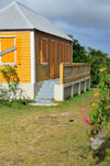 The Valley, Anguilla: orange cottage with zinc roof - Carribbean dwelling, Anguillean charm - photo by M.Torres