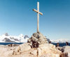 Petermann Island, Antarctica: peguins around a cairn with cross, commemorating the British explorers who died while crossing the sea ice in 1982 - photo by G.Frysinger