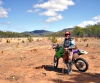 Australia - Wakooka Station (Queensland): bike rider and ant hills - photo by Luca Dal Bo