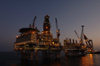 Caspian sea - oil rig - Topsides and CWP - BP is operator for the Azerbaijan International Operating Company (AIOC) - Central Azeri section of Azeri-Chirag-Gunashli oil field - dusk - photo by L.McKay