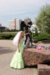 Belarus - MBelarus - Minsk - Isle of Tears - crying angel and bride - traditionaly newlyweds visit war memorials on their wedding day - photo by A.Dnieprowsky
