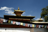 Bhutan - Paro dzongkhag - Bhuddist prayer flags and the roof of Kyichu Lhakhang, near Paro - photo by A.Ferrari