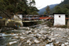Bhutan - covered bridge spanning the Wang Chhu - photo by A.Ferrari