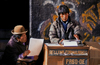 La Paz, Bolivia: street scribe types a letter for an illeterate Aymara woman - photo by C.Lovell