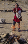 Isla del Sol, Lake Titicaca, Manco Kapac Province, La Paz Department, Bolivia: a kallawayas (shaman) performs a koada (offering) to Pancha Mama (Mother Earth) - bonfire - photo by C.Lovell