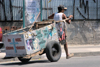 Brazil / Brasil - So Paulo: religion and money - man with cart - Rio Pequeno avenue / religio e dinheiro - Avenida do Rio Pequeno - Zona Oeste (photo by M.Alves)