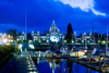 Victoria, BC, Canada: downtown at dusk - BC Legislature Parliament Buildings with low energy decorative lights in Victoria harbour - photo by D.Smith