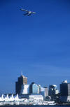 Vancouver, BC, Canada: floatplane flying in Burrard Inlet - city skyline - photo by D.Smith