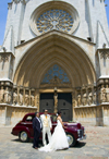 Tarragona, Catalonia: the Cathedral - bride and groom pose with a Vauxhall Wyvern LIX 4-Door Saloon car - photo by B.Henry