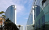 Barcelona, Catalonia: W Barcelona hotel and its reflection on a curtain wall, architect Ricardo Bofill - photo by M.Torres