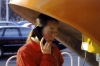 China - Beijing / Peking / Peipin / Pequin / Pequim / PEK / BJS :  woman on a public phone - orelho (photo by E.Luca)
