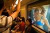 Shanghai, China: subway riders - ad girl at the window - photo by Y.Xu