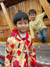 China - Hainan Island: brothers on boat (photo by G.Friedman)