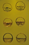 Bogota, Colombia: Gold Museum - Museo del Oro - tumbaga earrings - Zen filigree work - dignitaries and amphibian men - photo by M.Torres