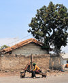 Goma, Nord-Kivu, Democratic Republic of the Congo: on of the many primitive cargo bicycles - the pusher takes a rest - chuckadoo - wooden trottinette - photo by M.Torres