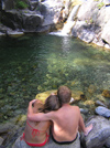 Manganello river valley: couple enjoy the falls (photo by J.Kaman)