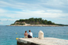 Croatia - Hvar island - Hvar: couple looking at  Jerolima island, Paklina archipelago - photo by P.Gustafson