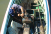 Cuba - Guardalavaca - fixing a boat engine - photo by G.Friedman