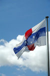 Curacao - Willemstad: Netherlands Antilles flag against summer sky - photo by S.Green