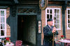 Ribe, southwest Jutland, Denmark: guardian with medieval weapon standing in front of restaurant - spiked club called a 'morning star' - photo by K.Gapys