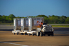 Punta Cana, Dominican Republic: cargo containers being towerd - type AKE / LD3 (ULDs) - TUG Technologies Corporation MA Tow Tractor - Punta Cana International Airport - PUJ / MDPC - photo by M.Torres
