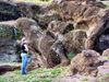 Easter Island / Rapa Nui: tourist examines stillborn moai - photo by Rod Eime