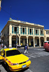 San Salvador, El Salvador, Central America: Parque Libertad - Portal 'la Dalia' and taxi - photo by M.Torres