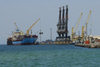 Eritrea - Massawa, Northern Red Sea region: harbour scene - Maersk Arkansas container ship and cranes - photo by E.Petitalot