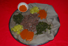 Lalibela, Amhara region, Ethiopia: injera with kifto meat and vegetables - bread made of teff flour, typical of Ethiopian cuisine - photo by M.Torres