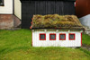 Gjgv village, Eysturoy island, Faroes: miniature house with peat covered roof - photo by A.Ferrari