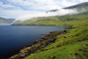 Srvgsfjrur fjord, Vgar island, Faroes: fog frames the hills - photo by A.Ferrari