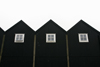 Norragta village, Eysturoy island, Faroes: black boat houses in the harbour - photo by A.Ferrari