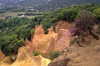 Roussillon, Vaucluse, PACA, France: the many hued cliffs of the former Ochre Quarries and the rolling hills of Roussillon - hoodoos in the Parc Naturel Rgional du Luberon - photo by C.Lovell