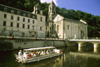 Brantme / Brantsme, Dordogne, Aquitaine, France: tour boat on theriver Dronne next to the Benedictine Abbey of Brantme - founded in 769 by Charlemagne - the Romanesque bell-tower it the oldest in France - photo by K.Gapys