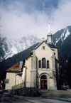 France / Frankreich -  Chamonix-Mont-Blanc (Haute-Savoi): church and Brvent mountain - Eglise de Chamonix et le Brvent - photo by M.Torres