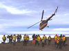 32 Franz Josef Land: Helicopter flying over passengers, Rudolf Island - photo by B.Cain