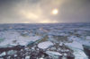 50 Franz Josef Land: Pack ice and low, diffuse sun from ship - photo by B.Cain