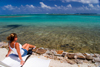 Papetoai, Moorea, French Polynesia: young woman by the lagoon - photo by D.Smith