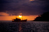 Isla Isabela / Albemarle island, Galapagos Islands, Ecuador: sunset behind the Samba - boat silhouette - photo by C.Lovell