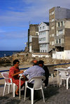 Galicia / Galiza - Malpica de Bergantios - A Corua province: people at a pavement caf by the beach - Costa da Morte - photo by S.Dona'