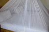 Banjul, The Gambia: bed covered by mosquito net, ready for the night - malaria prevention - photo by M.Torres