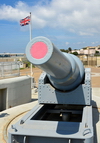 Gibraltar: Union Jack and RML gun at Harding's Battery, Europa Point - University of Gibraltar in the background -  photo by M.Torres