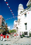 Gibraltar: Main Street, people in red and white on Gibraltar's National Day, September 10th - photo by M.Torres