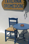 Greece, Dodecanese Islands,Kos: chair, table and restaurant sign - Taverna Oromedon - photo by P.Hellander