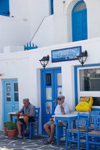Greece - Paros: two Greek men outside restaurant in Naousa - photo by D.Smith